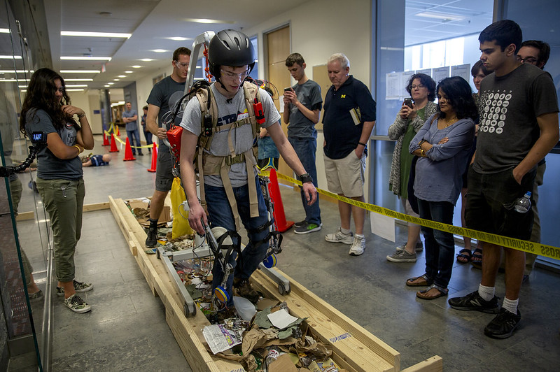 The STARX powered-exoskeleton team competing by walking over debris