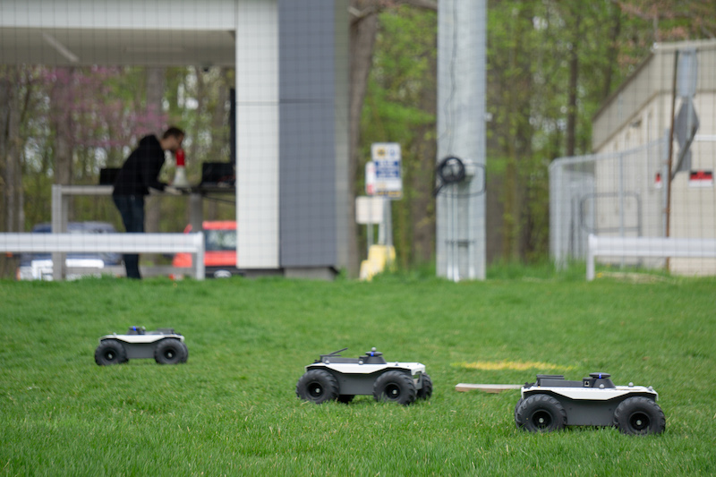 Three autonomous ground vehicles work together as they move